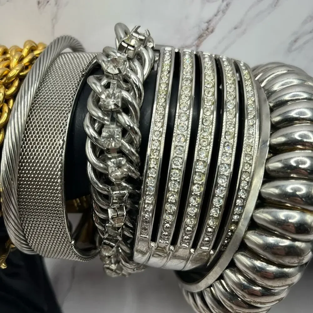 Set of 11 silver and gold tone bracelets